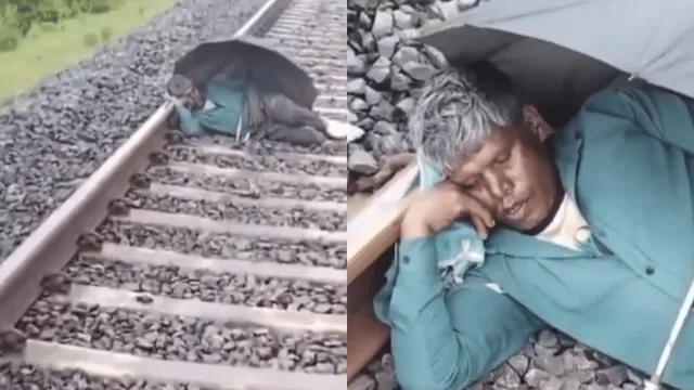 train-stops-midway-as-man-sleeps-on-railway-track-with-umbrella-viral-video